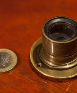 Small Brass lens from the 1900s with mounting flange