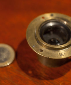 Small Brass lens from the 1900s with mounting flange