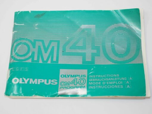Olympus OM40 Program manual |English | German | French | Spanish |Instructions